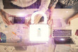 © peshkova - Double exposure of man and woman working together and lock hologram drawing. Security concept. Computer background. Top View.