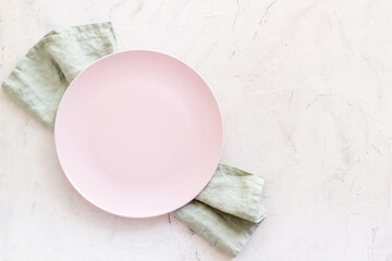 Wall Mural - Table setting for dinner. Empty plate on napkin - dishware top view