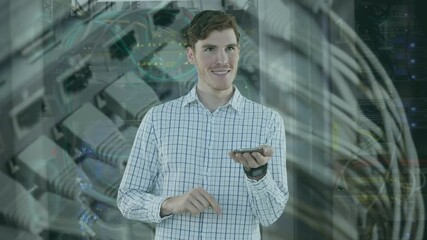 Poster - Animation of binary coding and caucasian businessman using smartphone over server room