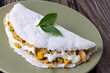 Chicken tapioca with corn and cream cheese. Basil leaf on top.