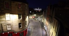 Famous Victoria Street At Night A Popular Venue With Traditional Shops And An Icon Of Edinburgh, Scotland, UK. Night Streets Of Scottish Capital, Edinburgh Castle In The Background