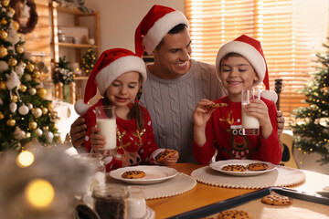 Sticker - Happy father and his children eating delicious Christmas cookies at home