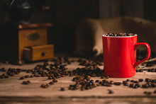 Cup Of Coffee Beans On Table