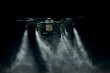 large agricultural drone sprays on a black background, streams of drops are sprayed