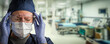Stressed Doctor or Nurse Wearing Medical Personal Protective Equipment (PPE) Within Hospital.