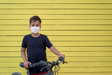 Kid With Facemask In A Yellow Background