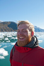 Blonde Man With Beard Laughing Ot Fjord In South Greenland