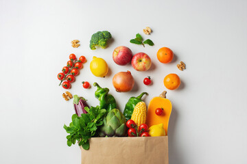 Wall Mural - Delivery healthy food background. Healthy vegan vegetarian food in paper bag vegetables and fruits on white. Shopping food supermarket and clean vegan eating concept