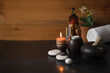 © Cavan Images - Wooden background with candles in the SPA care area