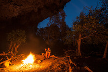 Mature Couple Enjoying Camp Fire In Laos