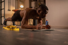 Determined African American Sportsman Doing Plank