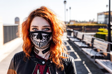 Portrait Of Gothic Girl With Orange Hair And Skull Face Mask