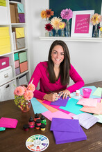 Portrait Of A Female Calligrapher Working In Colorful Office Setting
