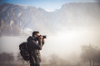 © Cavan Images - portrait of handsome man trekking in mountains in winter  outdoo