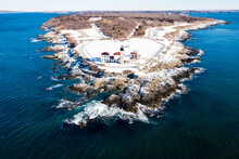 Beavertail Lighthouse Of Rhode Island In Winter Snow By Aerial Drone