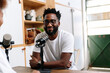© PICHA - Man recording a podcast