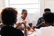 © PICHA - Friends having dinner
