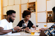 © PICHA - Friends having dinner