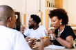 © PICHA - Friends having dinner