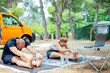 © Cavan Images - Couple learning yoga online outside