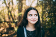 © Cavan Images - Happy Portrait Of A Young Teen Girl Outside Looking To Her Left