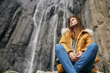 Wall Mural - woman yellow jacket tourism mountains adventure landscape