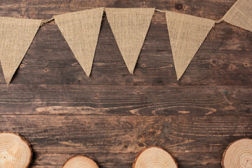 Poster - Christmas wood log plate and kraft flag on brown wooden table