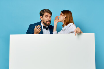 Wall Mural - Man and woman advertising presentation white banner blue background