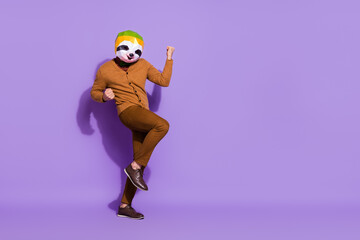 Sticker - Full length portrait of weird unusual red panda mask person raise fists triumph isolated on violet color background