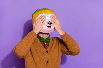 Wall Mural - Photo of young man cover eyes arms have fun playful fooling surreal isolated over purple color background