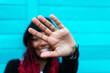 © ADDICTIVE STOCK - Glad ethnic woman showing stop gesture