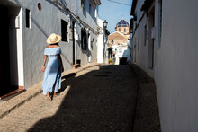 Anonymous Woman On Street Of Old Coastal Town In Altea
