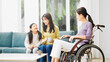 © aijiro - バリアフリーイメージ　車椅子のシニア女性と話す娘と孫