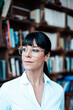 © Westend61 - Female entrepreneur with eyeglasses looking away at coffee shop