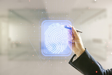 Poster - Man hand with pen working with abstract virtual fingerprint hologram on blurred office background. Multiexposure
