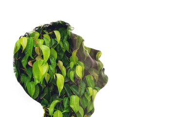 Wall Mural - Combination of the silhouette of a man face and a picture with green leaves. Concept of the connection people and nature