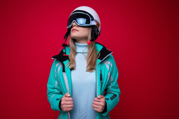 Wall Mural - Portrait of a young woman in a ski helmet and glasses