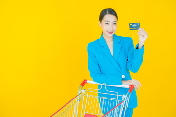 Portrait beautiful young asian woman smile with grocery basket