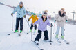 © View Stock - young parents and children ski in ski resort