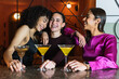 © Westend61 - Young friends smiling together by drink at restaurant