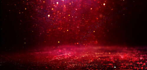 Wall Mural - background of abstract red, gold and black glitter lights. defocused