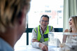 © Westend61 - Male architect smiling during meeting in office