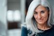 © Westend61 - Businesswoman with white hair at office