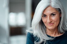 Businesswoman With White Hair At Office