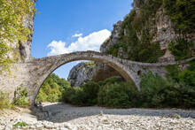 Greece, Epirus, Zagori, Old Arch Bridge InVikos-AoosNational Park During Summer