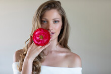 Beautiful Woman Holding Red Poppy Flower