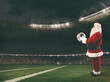 © alphaspirit - Santa Claus with a soccer ball in his hands inside a soccer stadium