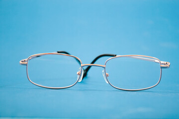 optical glasses on a blue background