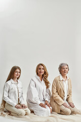 Wall Mural - Vertical portrait of three generations of Caucasian women