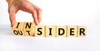 Insider or outsider symbol. Businessman turns a cube, changes the word insider to outsider. Beautiful white table, white background. Business, insider or outsider concept. Copy space.